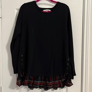 Black and plaid ruffled button shirt.